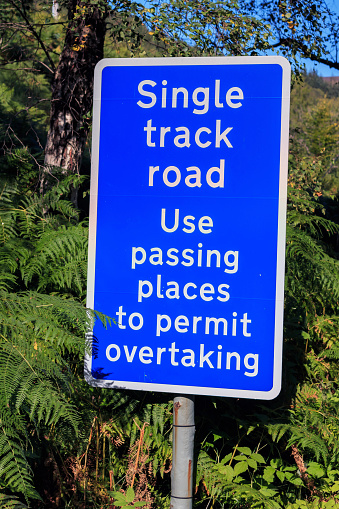 Single track road use passing places sign