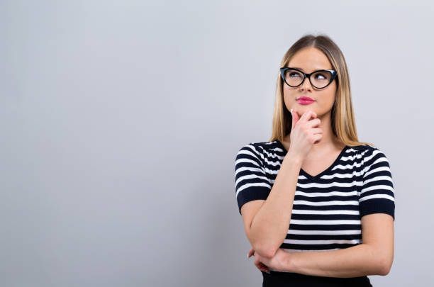istock Young woman in a thoughtful pose 1082883282