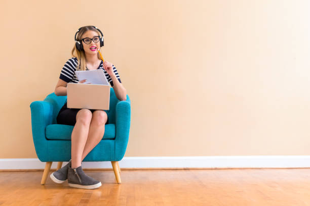 istock Young woman studying on her laptop computer 1082883298