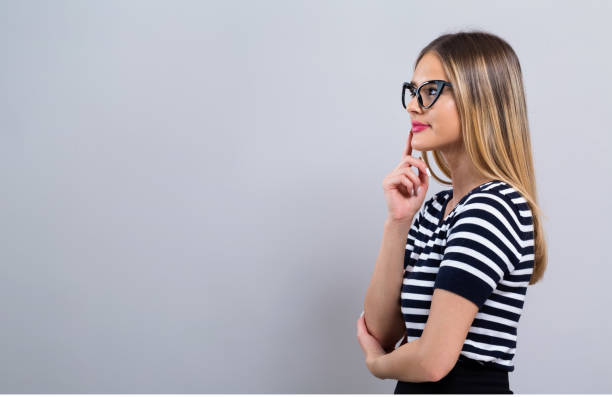 istock Young woman in a thoughtful pose 1082883306