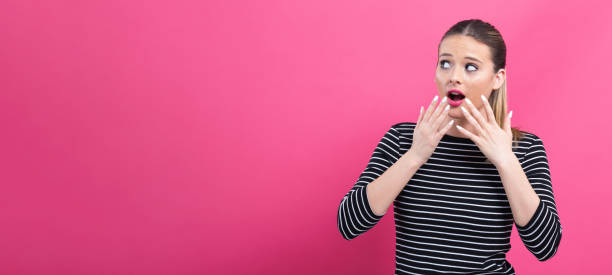 istock Surprised young woman posing 1082883368