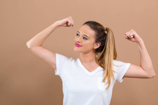 istock Powerful young woman in success pose 1082883544