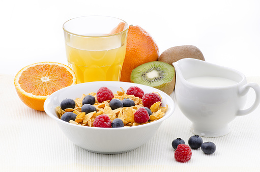 morning breakfast with fresh fruit, cereal flakes and milk