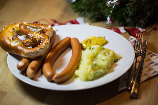 traditional Christmas dinner in Germany, sausages and potato salad