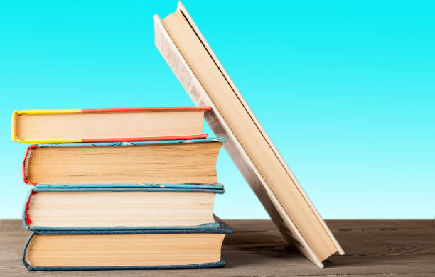 istock a group of books on a wooden surface folded vertically 1082887532