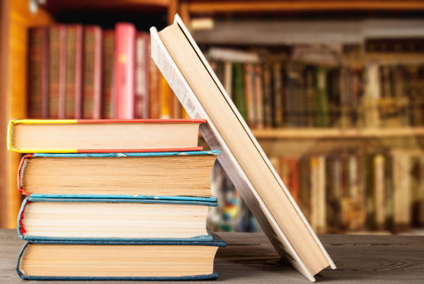 istock group of books on a wooden surface 1082887782