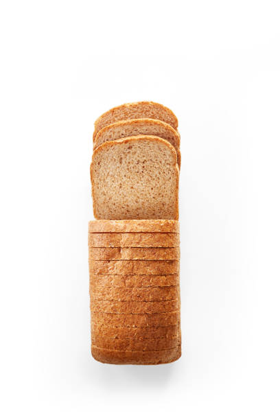 Sliced toast bread isolated on a white background. Toast loaf sliced viewed from above. Top view stock photo