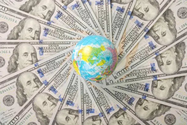 Photo of Earth globe on mandala kaleidoscope from money.