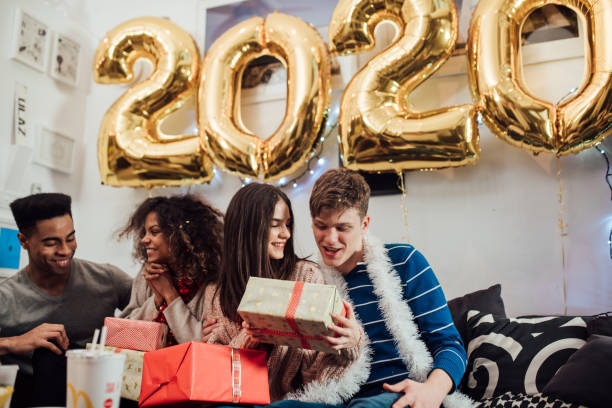 istock Teenagers opening Christmas presents 1082902922