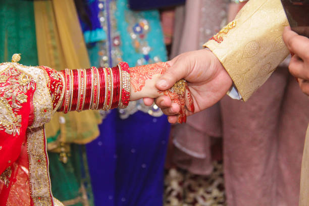 istock wedding bride and groom close up hands 1082911144