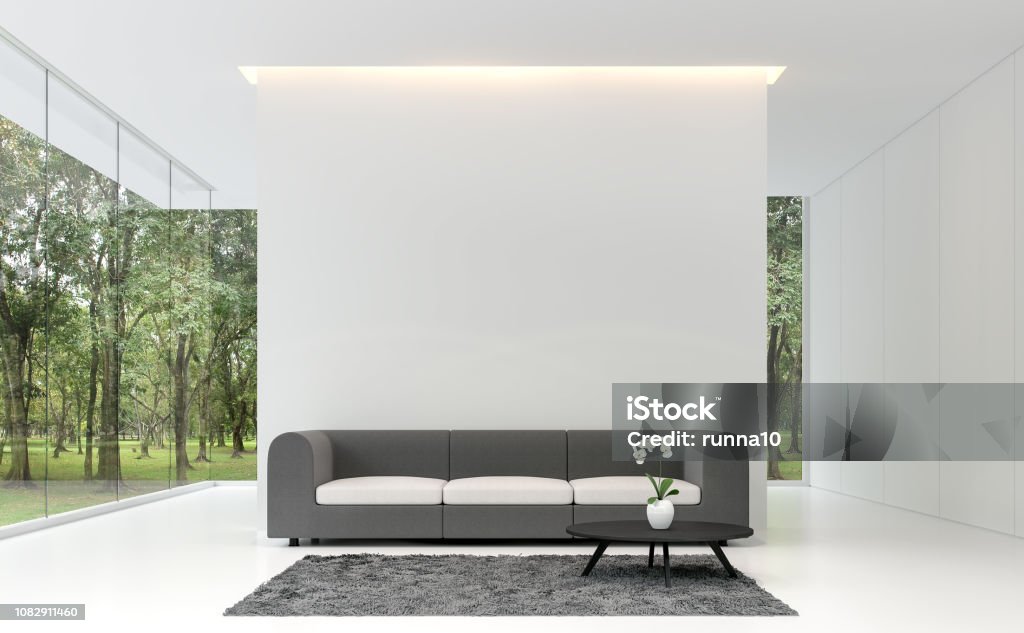 Minimal living room with white backdrop 3d rendering image Minimal living room with white backdrop 3d rendering image.A white room decorated with gray fabric furnishings, decorated with gray carpets. Large frameless windows overlooking the garden. Living Room Stock Photo