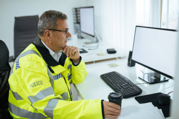 istock Traffic warden drinking coffee at the office 1082914074