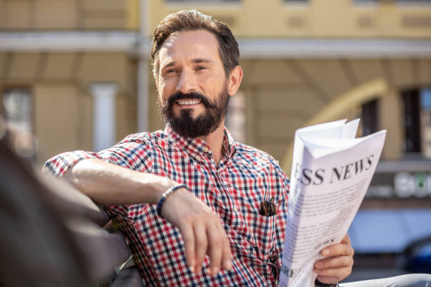 istock Smiling handsome man resting on the bench 1082920944