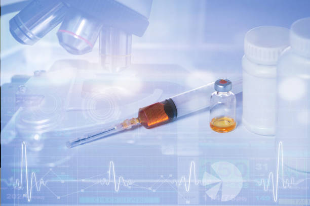 istock double exposure of injection medicine and microscope 1082921042