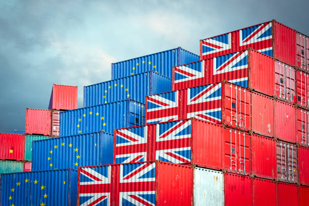 EU and British cargo containers Cargo containers with European Union and British flags reflecting Brexit and restrictions in export and import british flag photos stock pictures, royalty-free photos & images