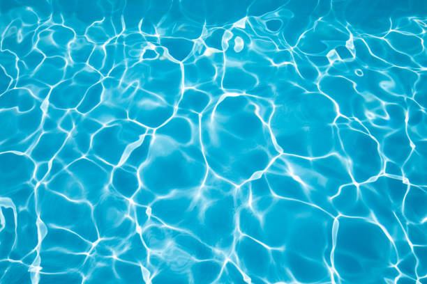 Beautiful ripple wave and blue water surface in swimming pool, Blue water for background and abstract