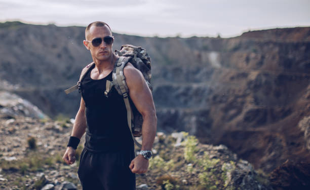 istock Strong man standing on the cliff 1082959214
