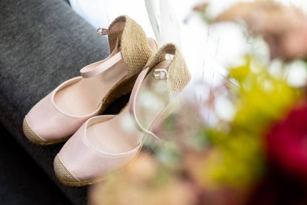 istock pink women's shoes next to a window 1082961212
