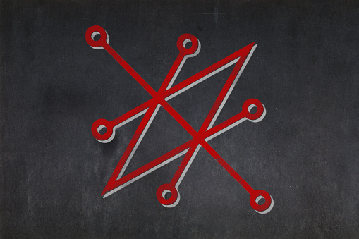 Blackboard with a the Sigil of Azazel drawn in the middle.