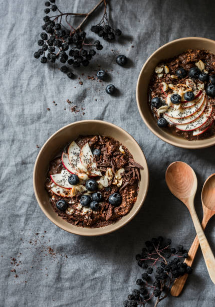 istock Chocolate overnight oat - healthy vegetarian breakfast on a grey background, top view. Flat lay, copy space 1082966654