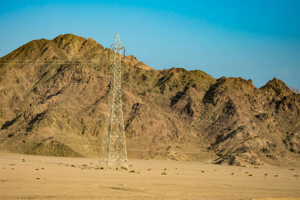 istock Power lines passing through the mountains of Egypt 1082998626