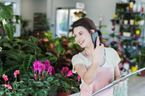 istock Girl showing plants by an app 1083002424