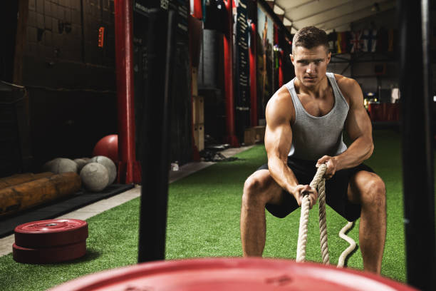 istock Sled drag exercise. Sportsman during his cross training workout. 1083005752