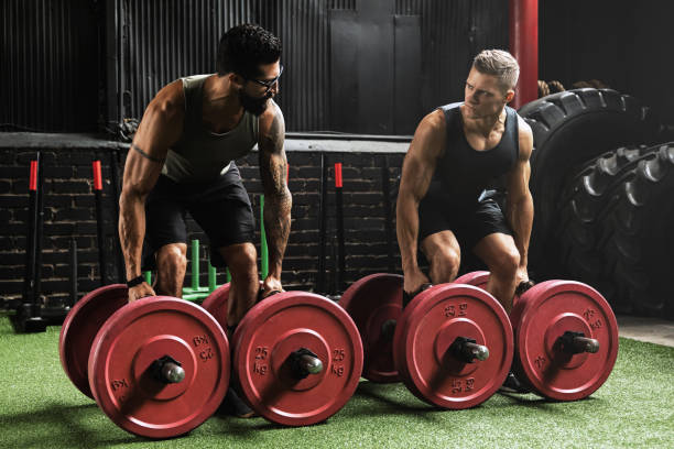istock Muscular men during competition in the farmer's walk exercise 1083005822