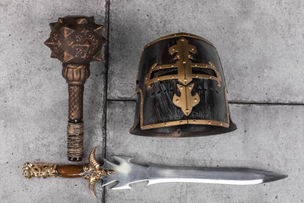 istock ancient military helmet and antique weapons 1083013388