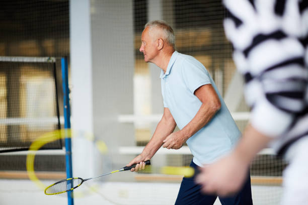 istock Playing badminton on court 1083017164