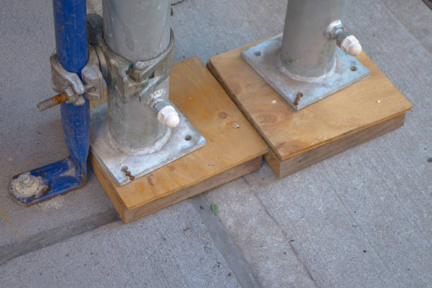 istock leveling off construction scaffolding with wood pegs and nails 1083018176