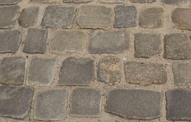 istock Grey Old Stone Pavement Top View or Granite Cobblestone Road 1083019618