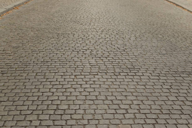 istock Grey Old Stone Pavement Top View or Granite Cobblestone Road 1083019646