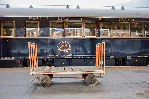 Prague, Czech Republic, October 4, 2012: The Orient-Express has arrived at Prague Smichov Station. Baggage carts are ready for the luggage of the passengers. The Venice Simplon-Orient-Express, is a private luxury train service, known as the Orient Express.