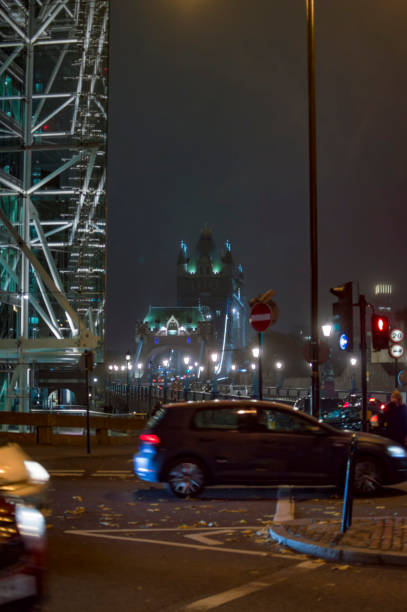 istock Lonon tower bridge in the background from the tower hill road at night 1083036992