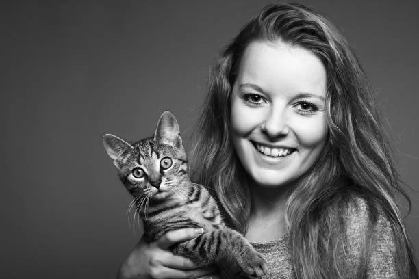 istock Beautiful caucasian woman with a cat 1083052448