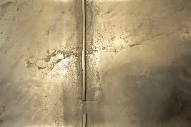 istock Structural plaster, imitation of a rusty sheet of metal with rivets. Creative vintage background. 1083057200