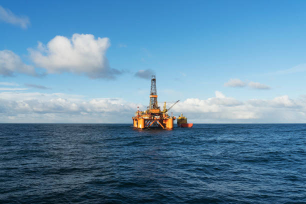 istock Offshore oil rig and supply ship 1083060024