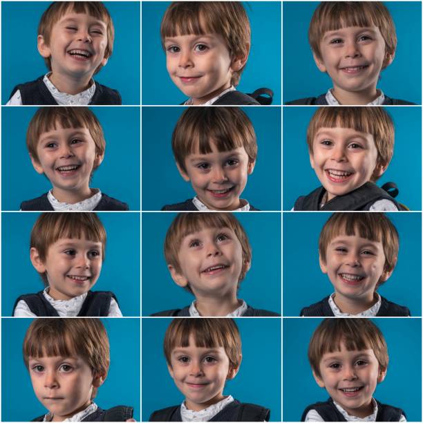 istock Little schoolboy making various facial expressions 1083063550