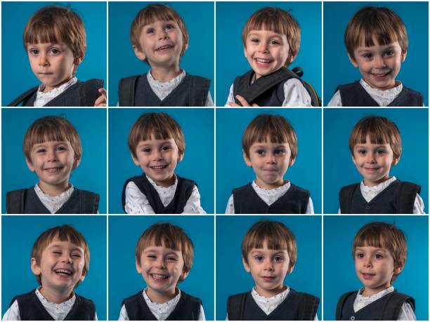 istock Little schoolboy making various facial expressions 1083063756