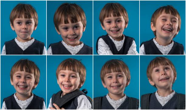 istock Little schoolboy making various facial expressions 1083063790