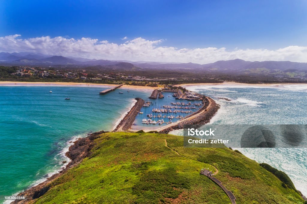 D Coffs Harbour island 2 Harb Coffs harbour town waterfront from Muttonbird island connected to shore by stone wave breaking wall protectin marina and local sandy beach. Coffs Harbour Stock Photo