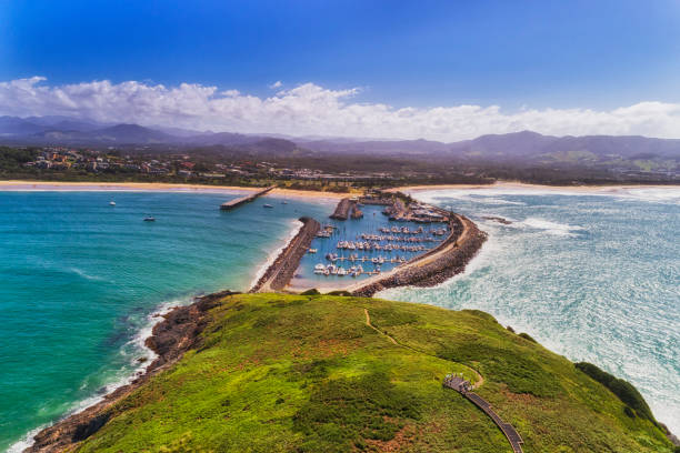 D Coffs Harbour island 2 Harb Coffs harbour town waterfront from Muttonbird island connected to shore by stone wave breaking wall protectin marina and local sandy beach. coffs harbour stock pictures, royalty-free photos & images