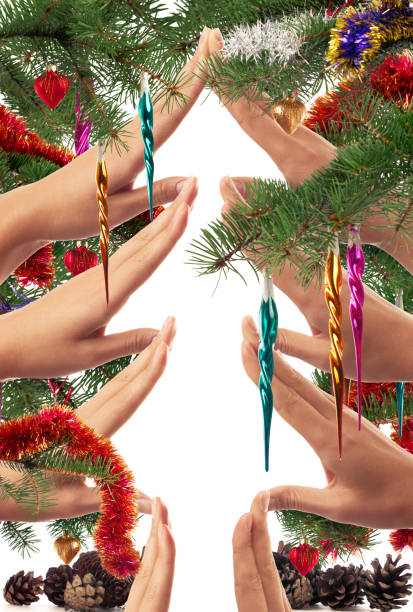 Christmas themed concept of hands making a Christmas tree shape