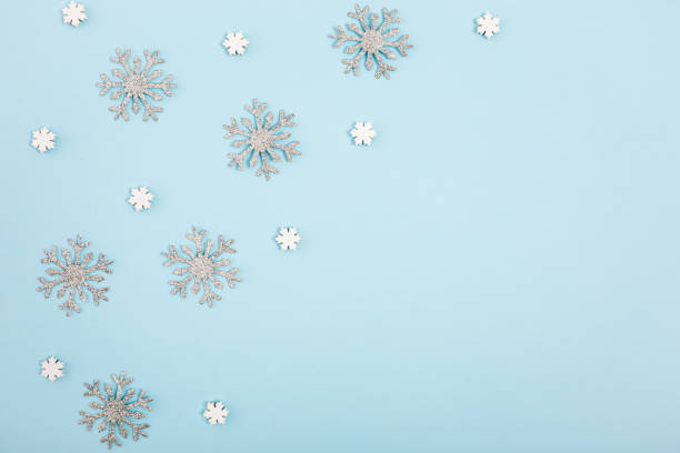 istock Pattern made with different snowflakes on pastel blue background. Christmas, winter, new year concept. Copy space. View from the top. 1083070414