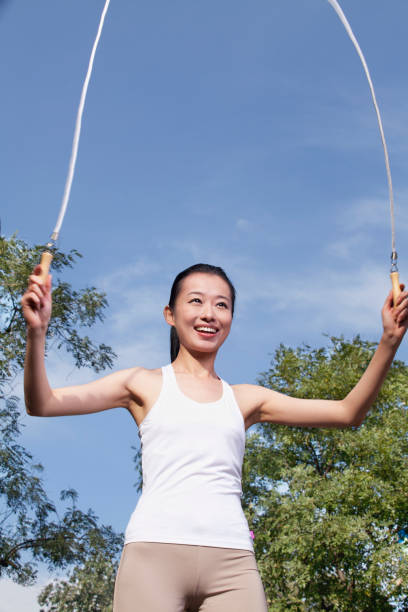 istock Chinese woman jumping rope 1083073006