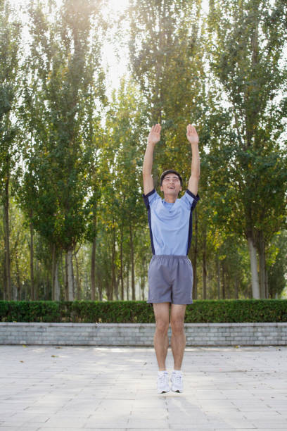 istock Chinese athlete exercising in public park 1083073216