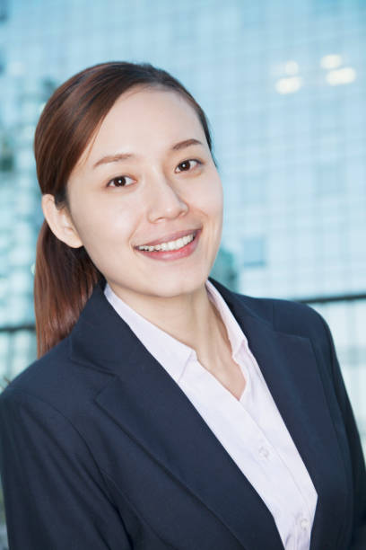istock Smiling Chinese businesswoman looking at camera 1083076674