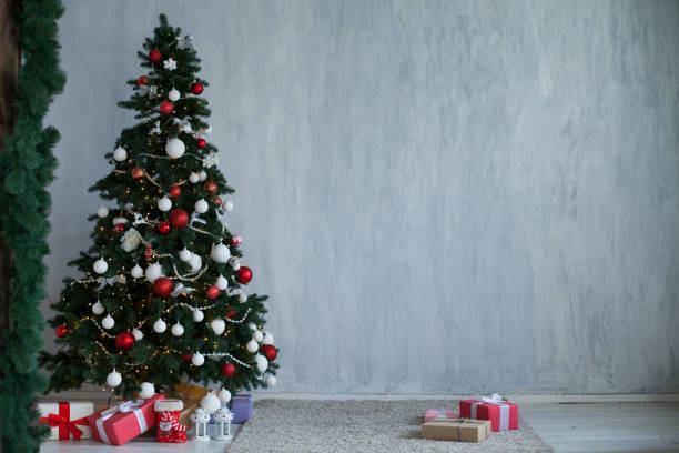 istock Christmas Interior new year postcard Christmas tree on a grey background gifts 1083076808