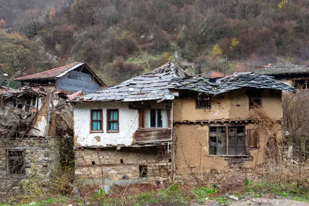 Old poor houses in the village of Pirin in Pirin Mountain, Bulgaria falling into ruin